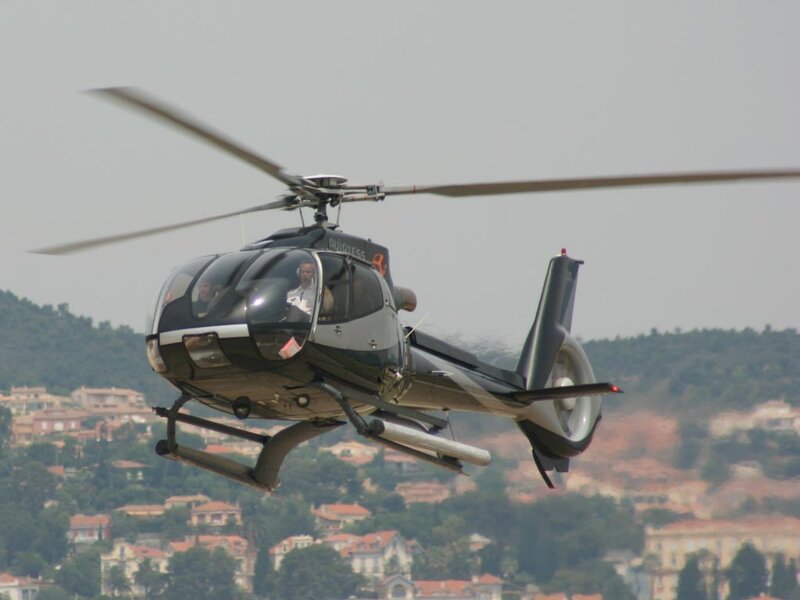 helicopter in flight over town