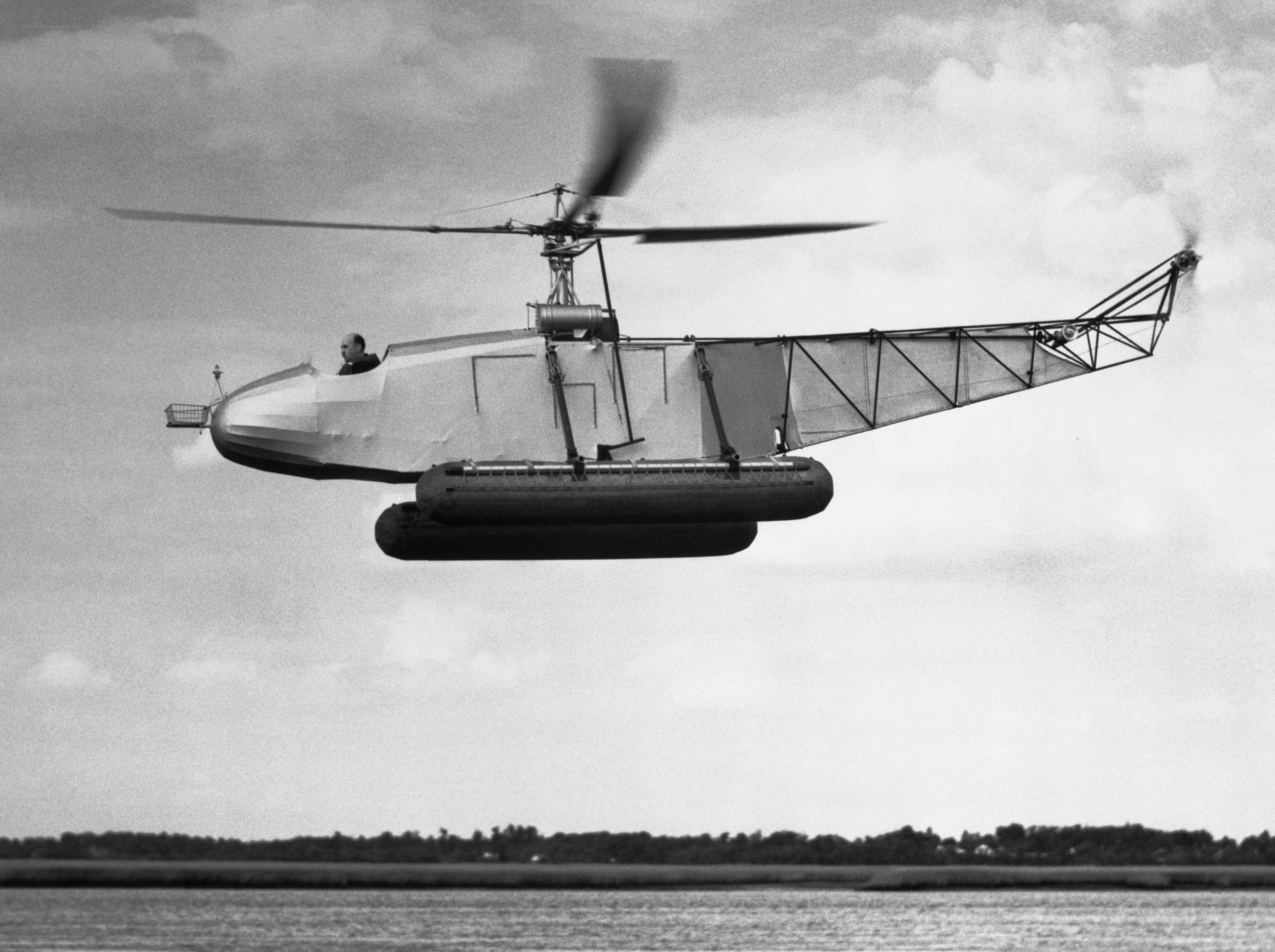 Helicopter in flight over water