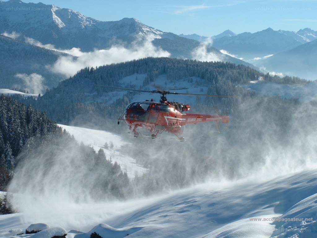 Helicopter in snowy mountains