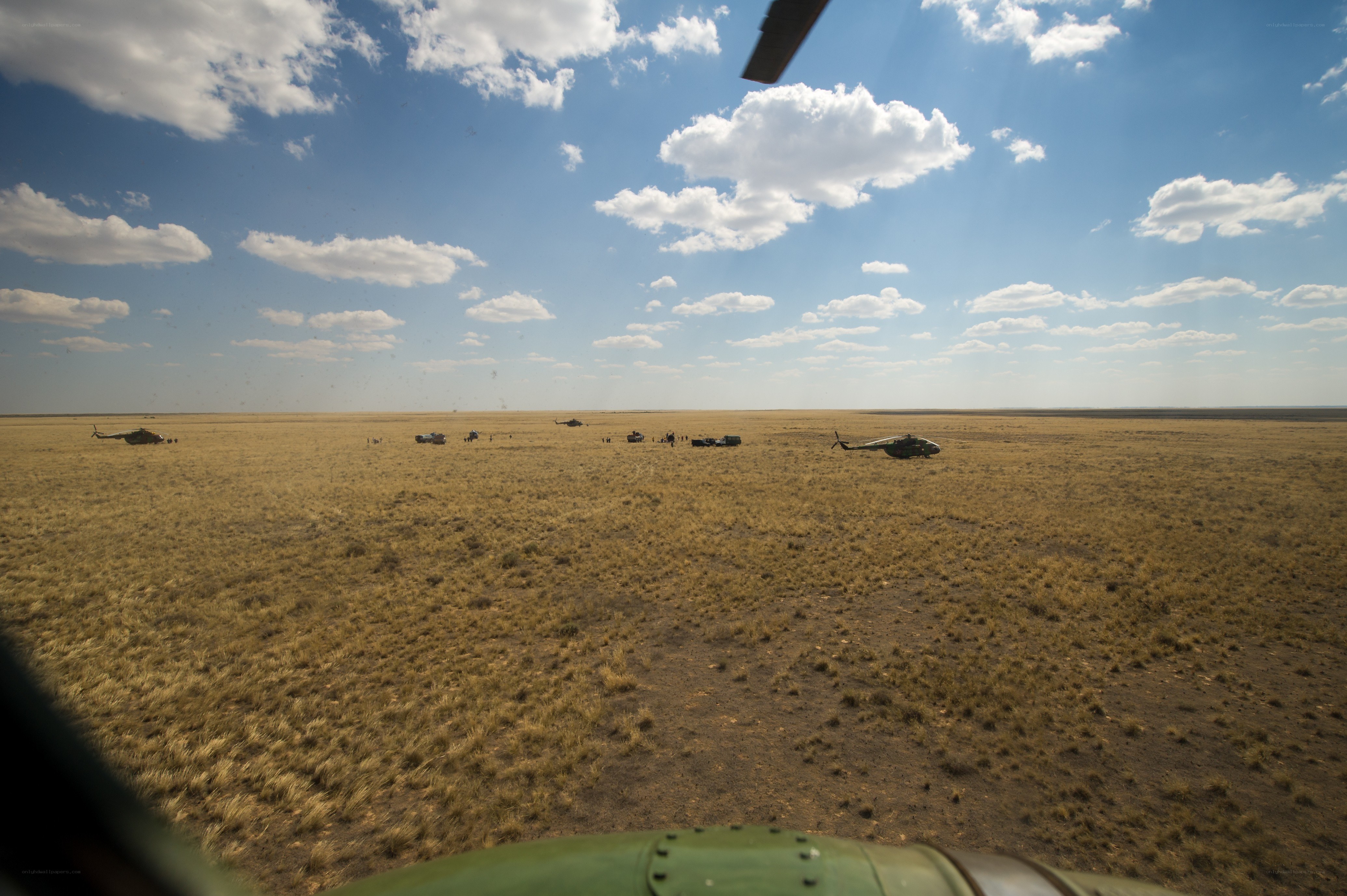 Helicopter landing in a field