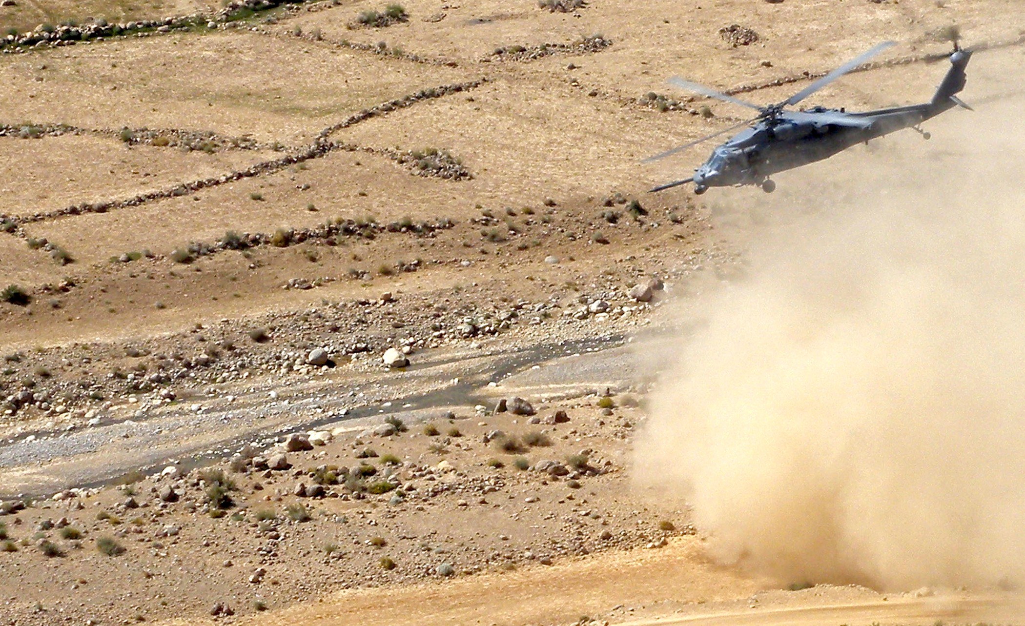 Helicopter landing in desert