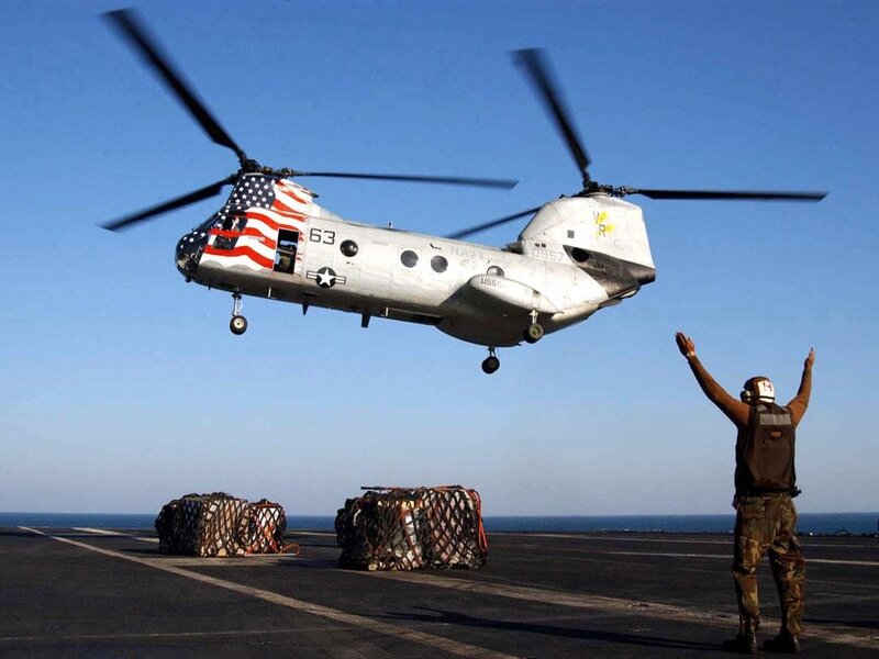 Helicopter landing on aircraft carrier