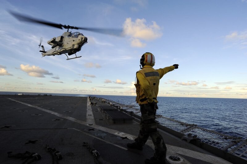 Helicopter landing on aircraft carrier