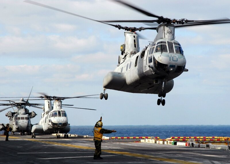 Helicopter landing on aircraft carrier