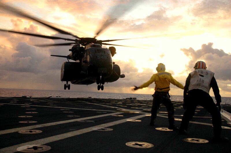 Helicopter landing on aircraft carrier