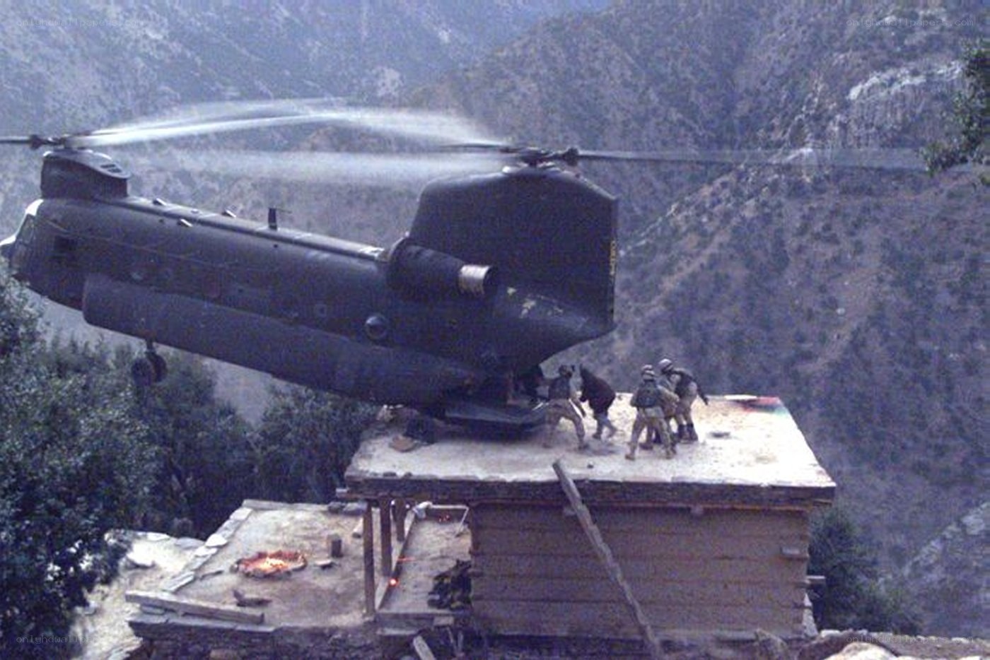 Helicopter landing on mountain outpost