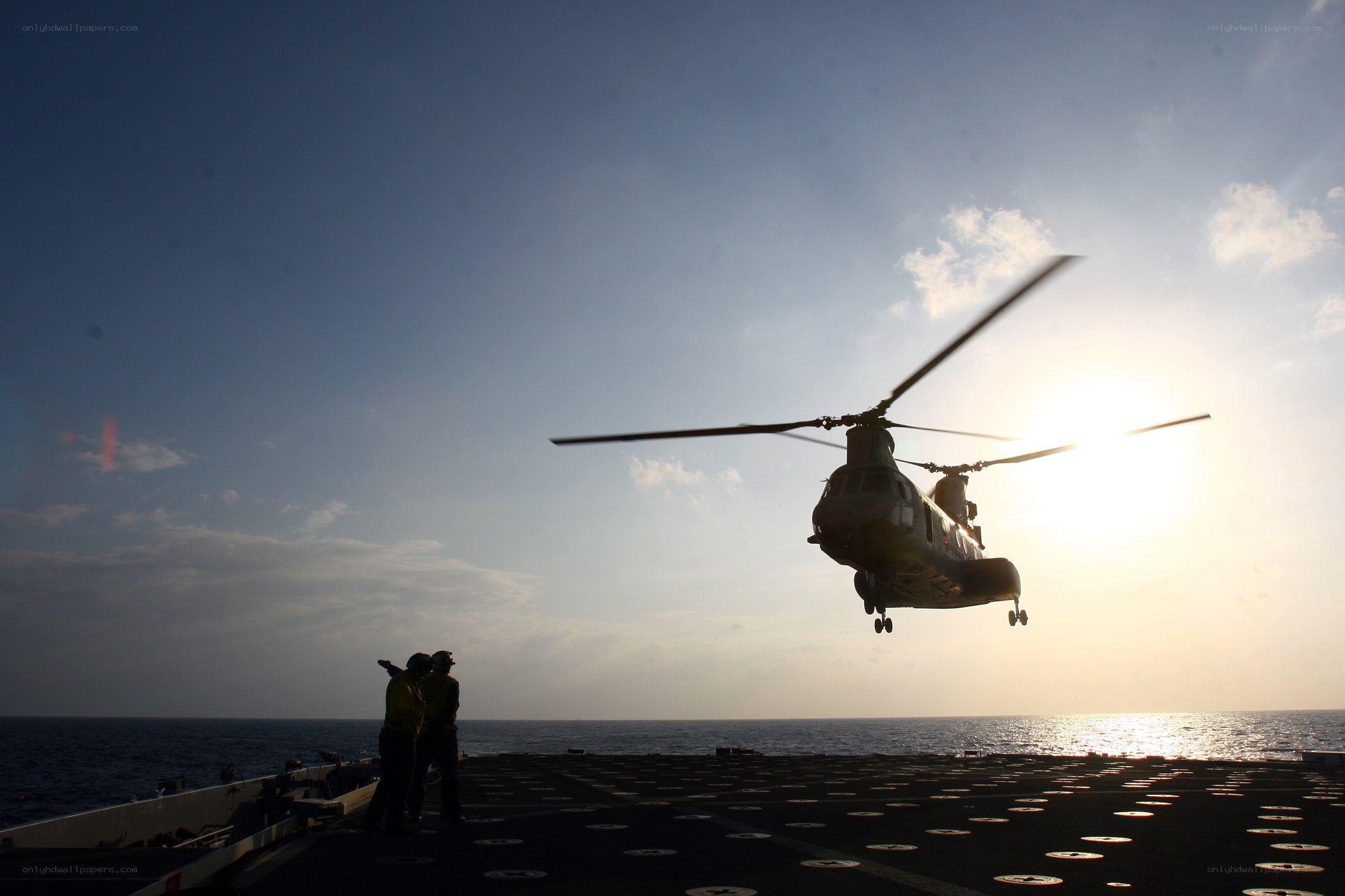 Helicopter landing on ship deck