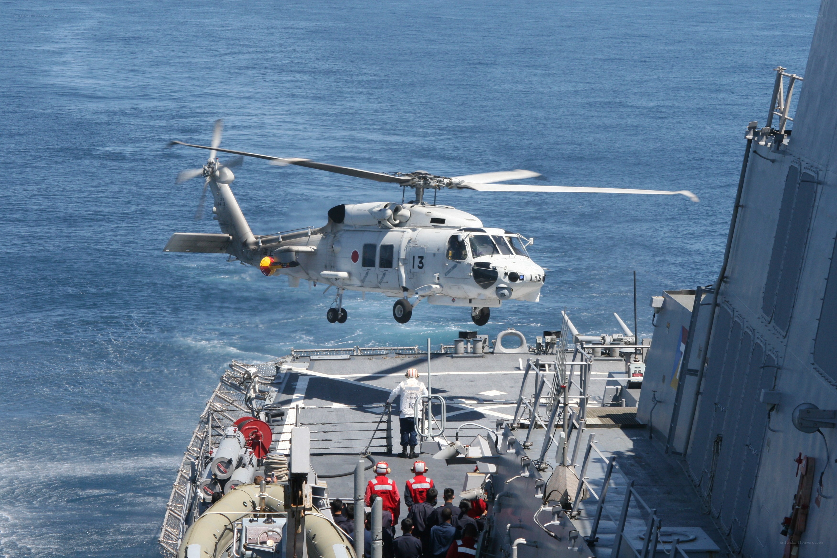 Helicopter landing on ship deck