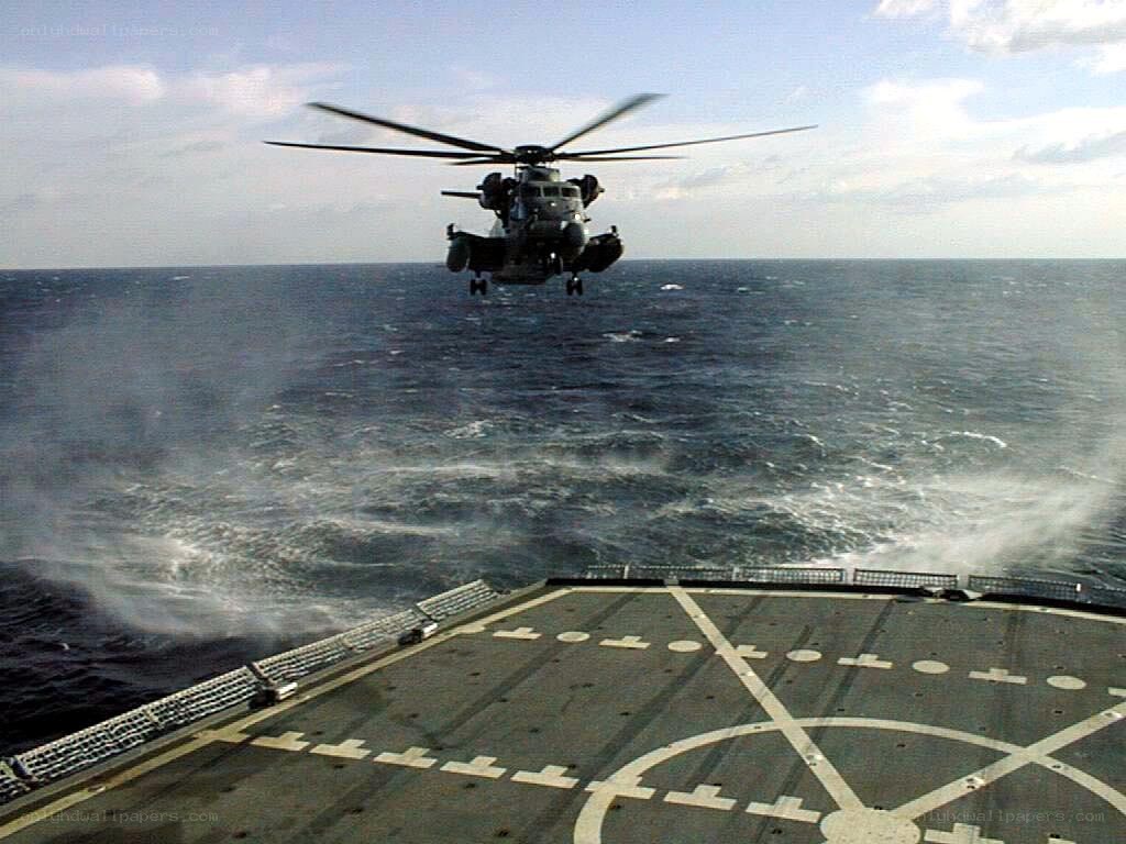 Helicopter landing on ship deck