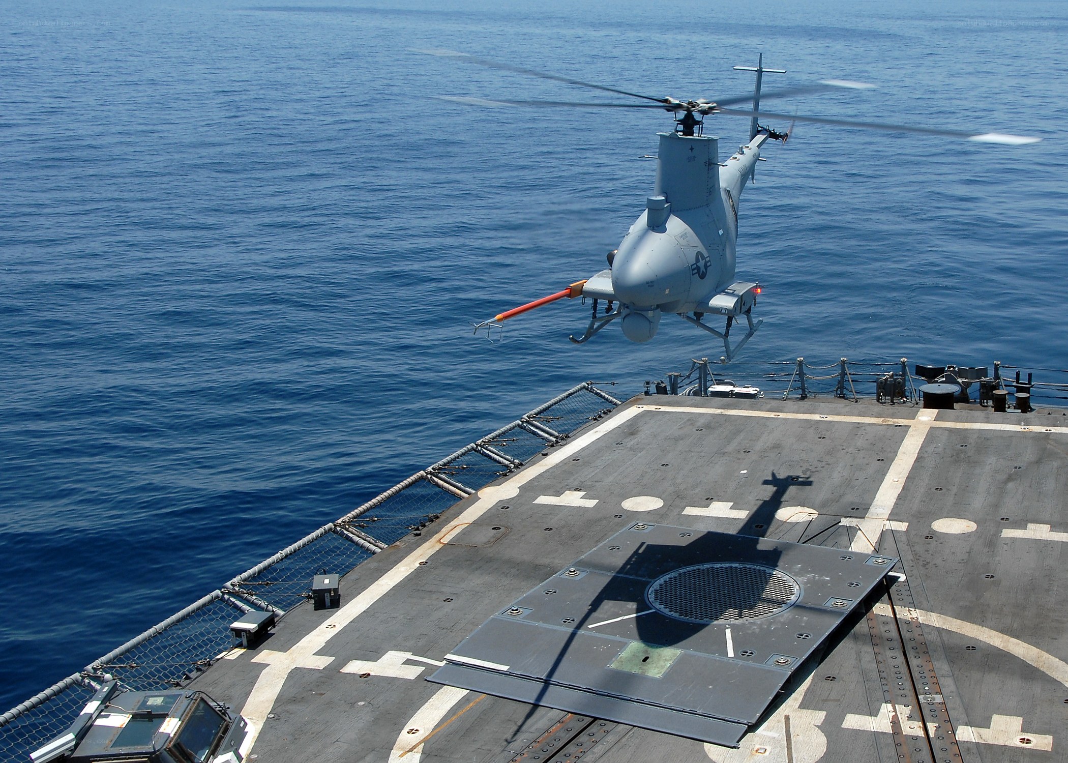 Helicopter landing on ship deck