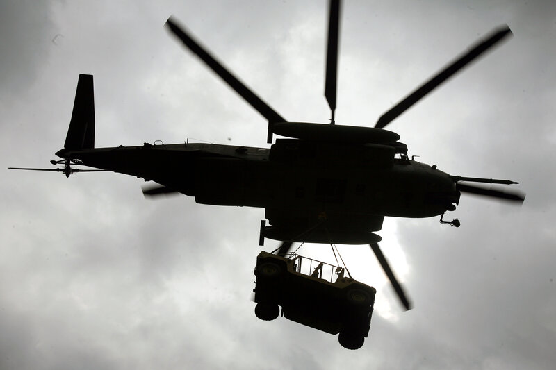 Helicopter lifting a vehicle