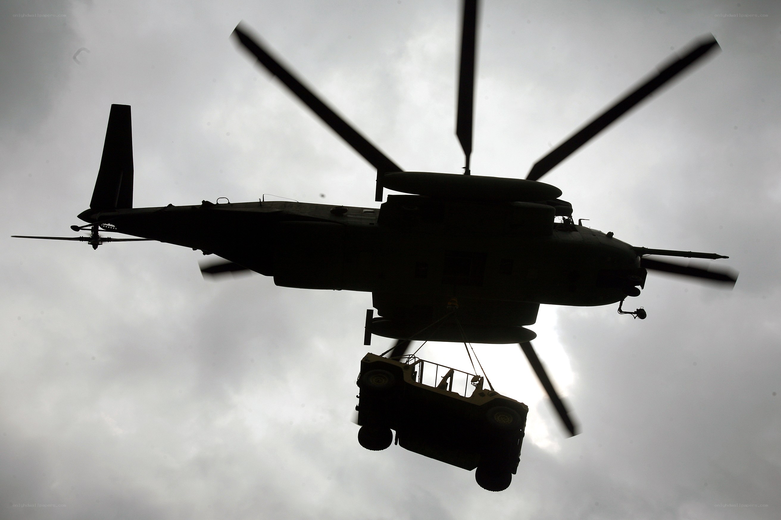 Helicopter lifting a vehicle