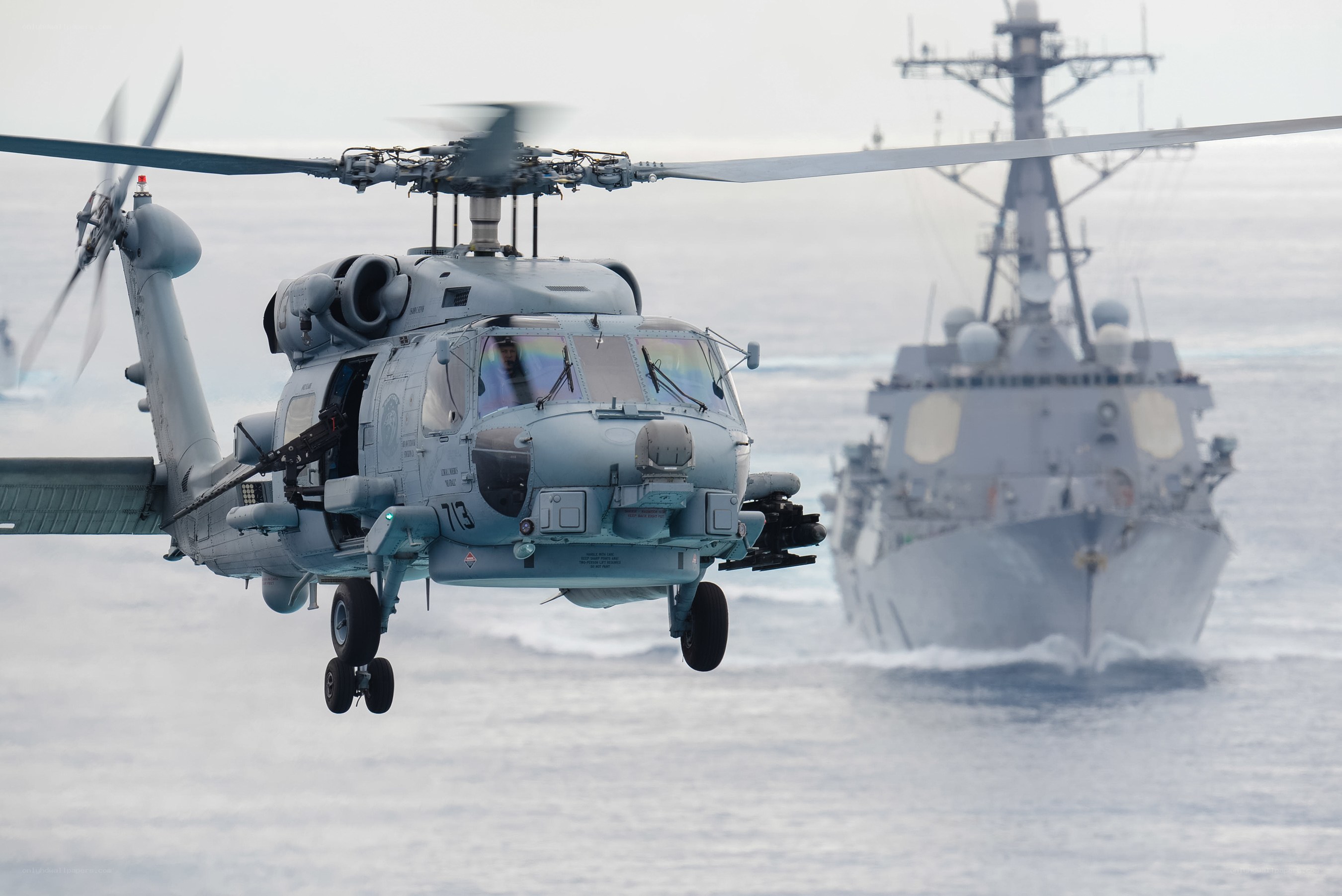 Helicopter near naval ship