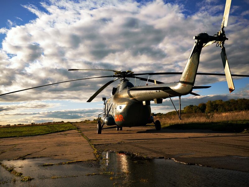 Helicopter on a tarmac at sunset