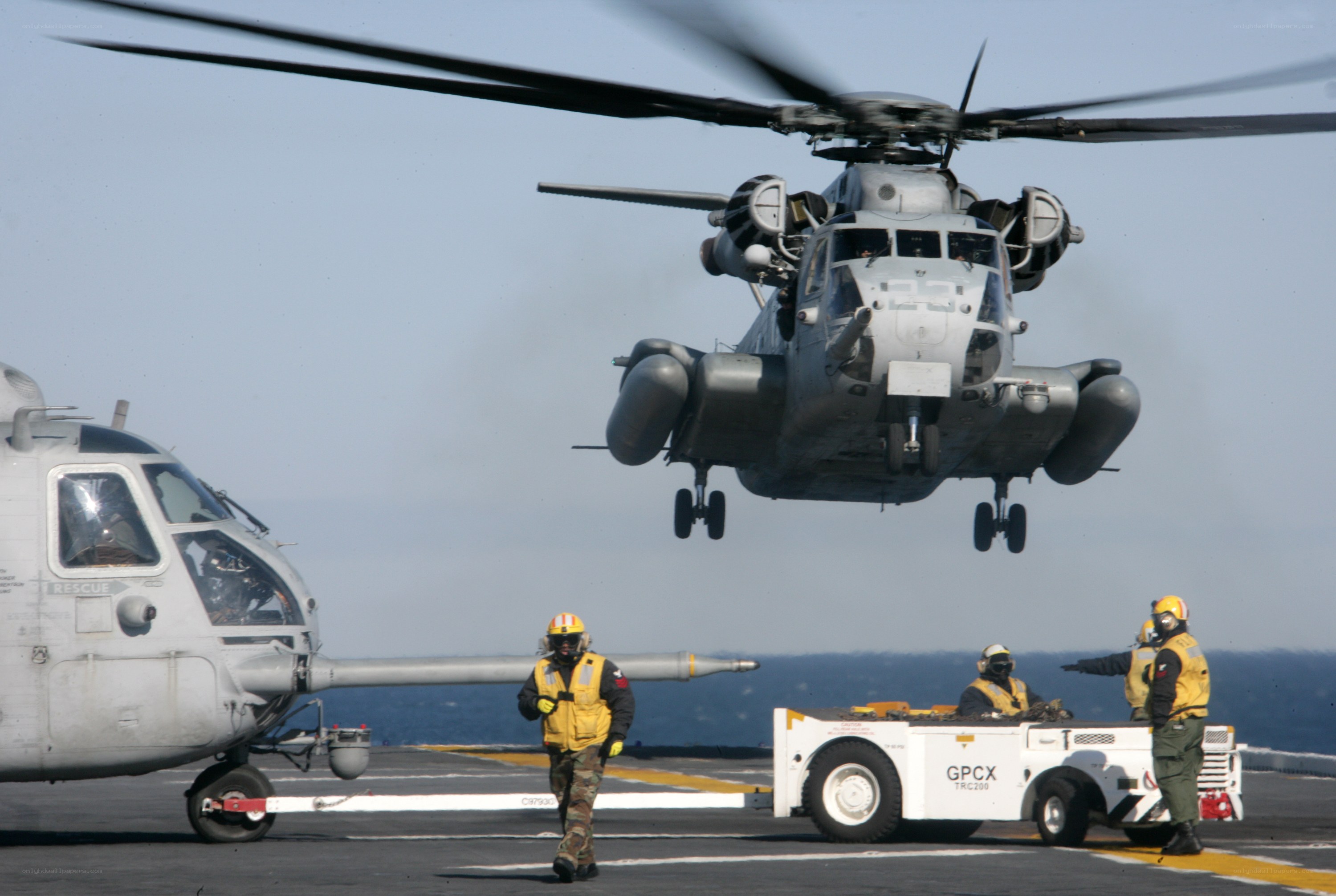 Helicopter on aircraft carrier deck