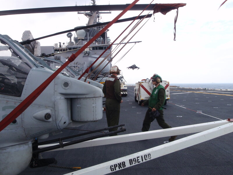 Helicopter on aircraft carrier deck