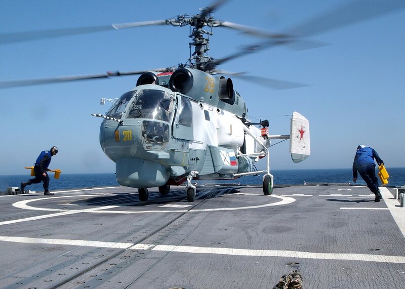 Helicopter on aircraft carrier deck
