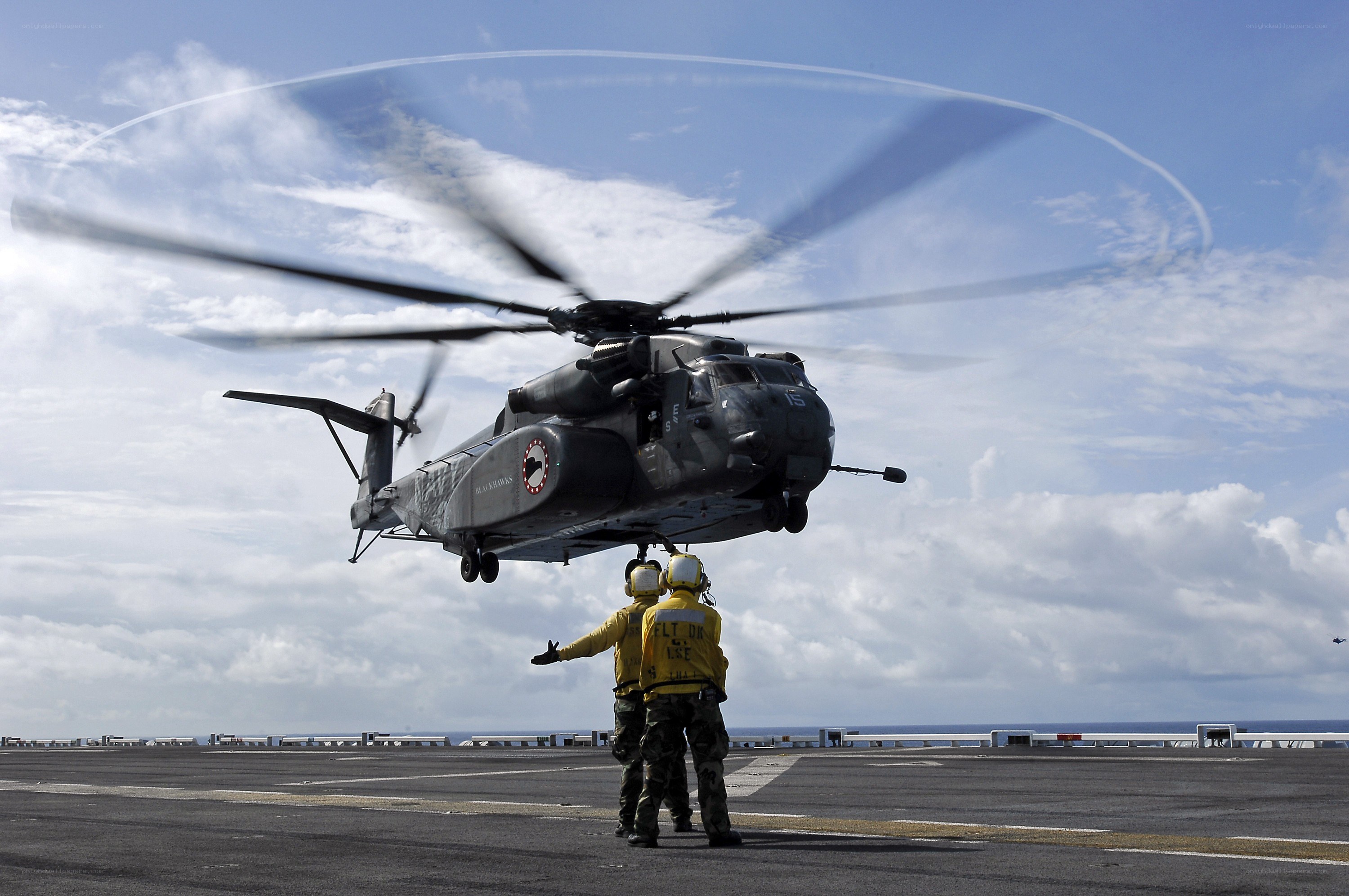 Helicopter on aircraft carrier deck