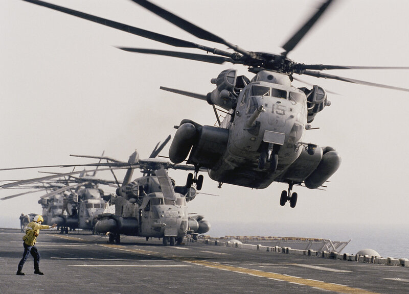 Helicopter on aircraft carrier deck