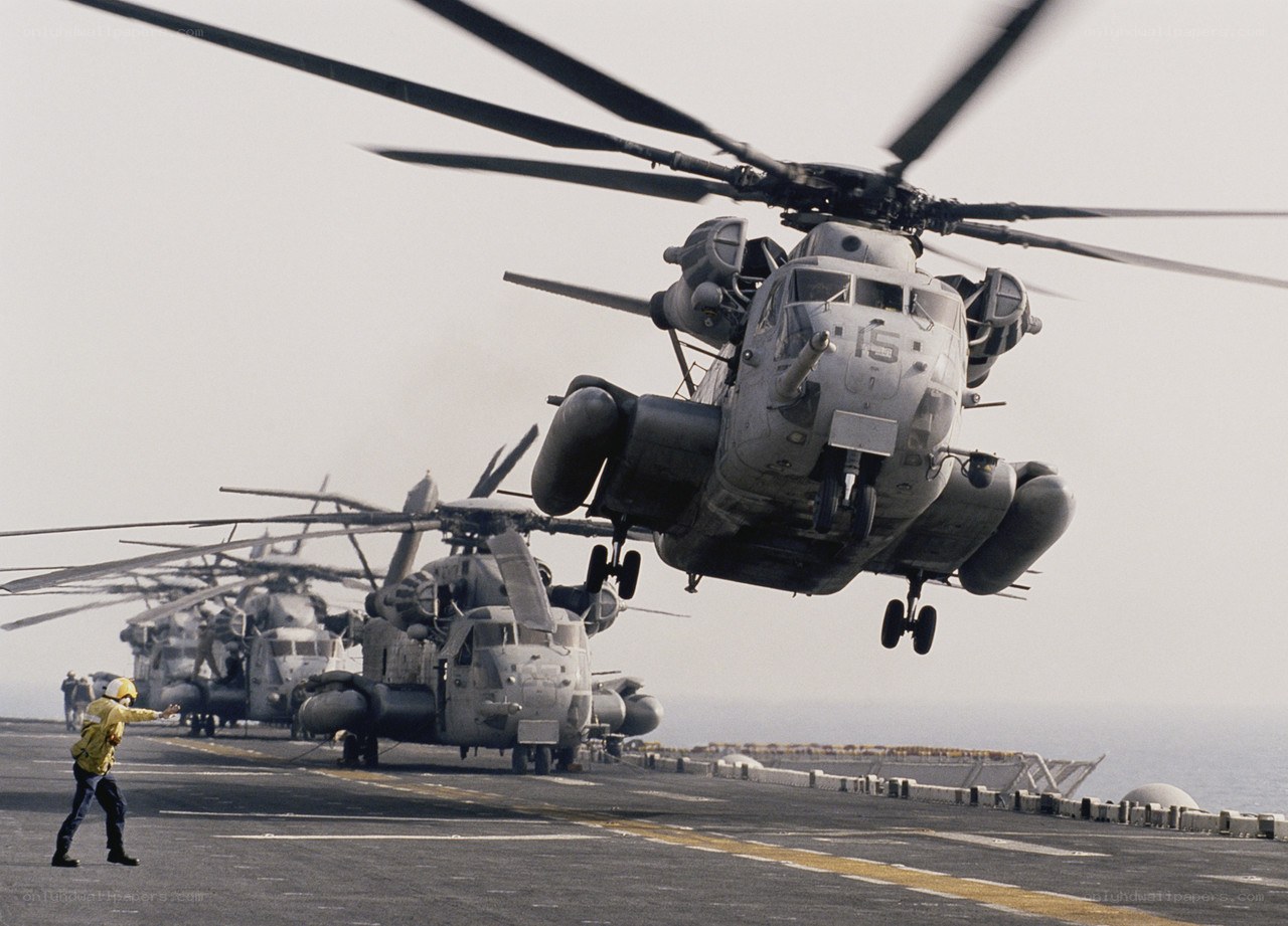 Helicopter on aircraft carrier deck