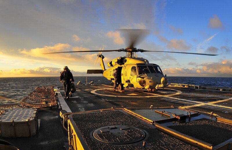 Helicopter on aircraft carrier deck