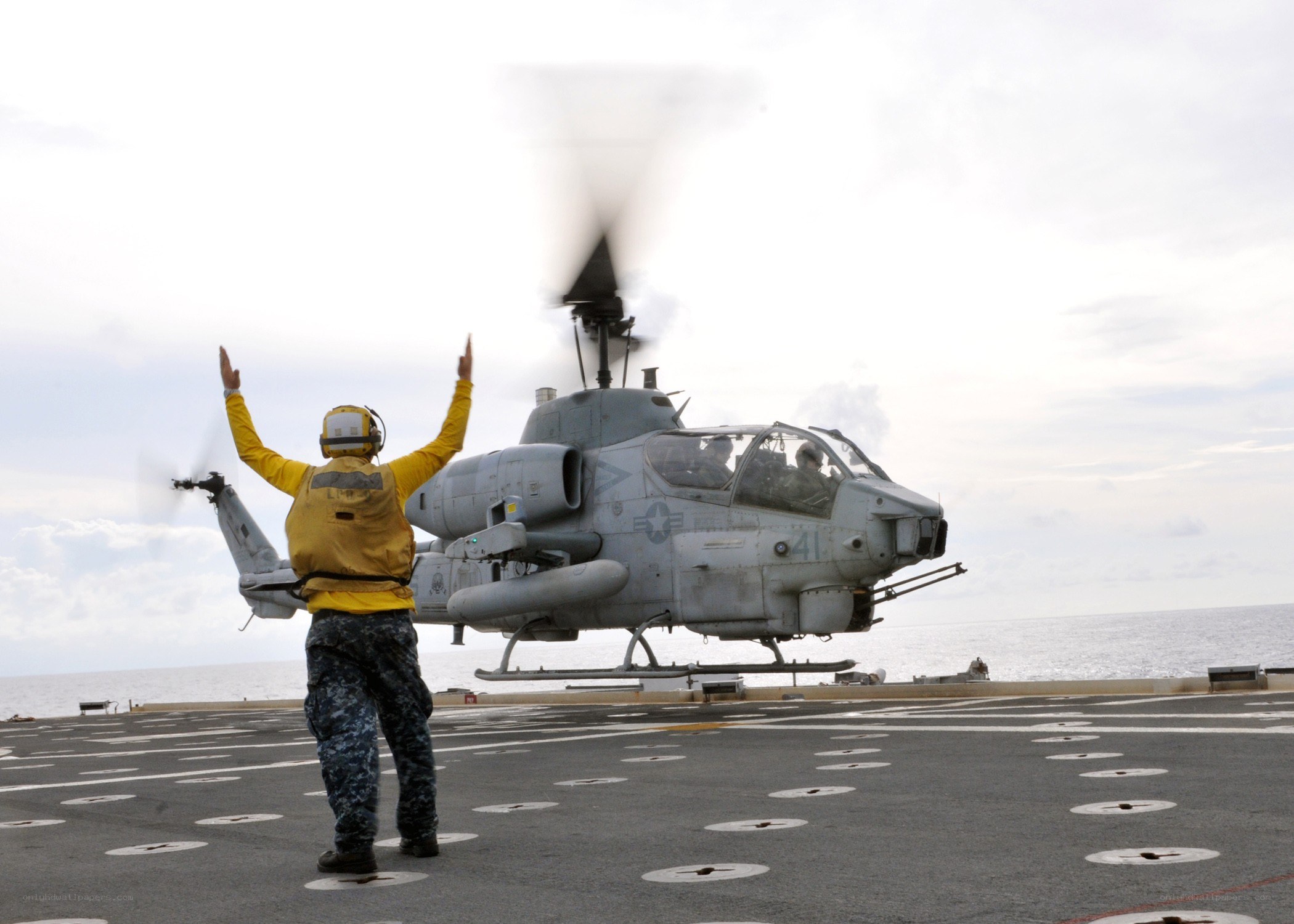 Helicopter on aircraft carrier deck