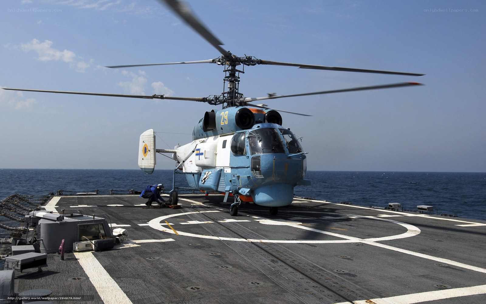 Helicopter on aircraft carrier deck