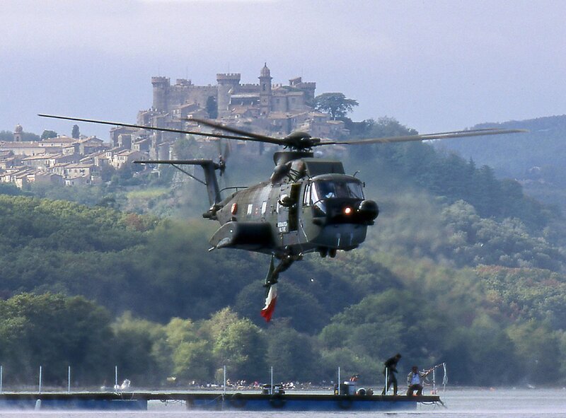 Helicopter over a lake with castle