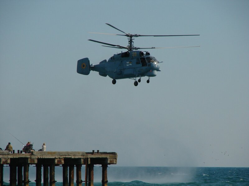 Helicopter over a pier