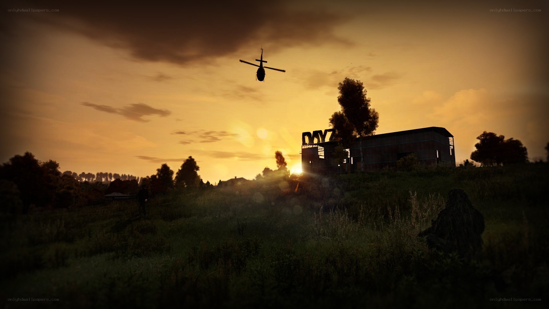 Helicopter over a rural building at sunset