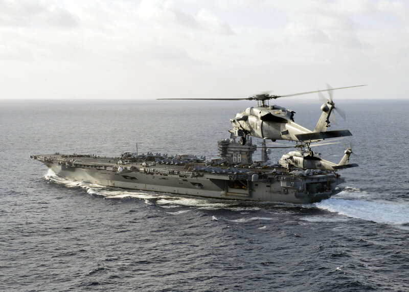 Helicopter over Aircraft Carrier