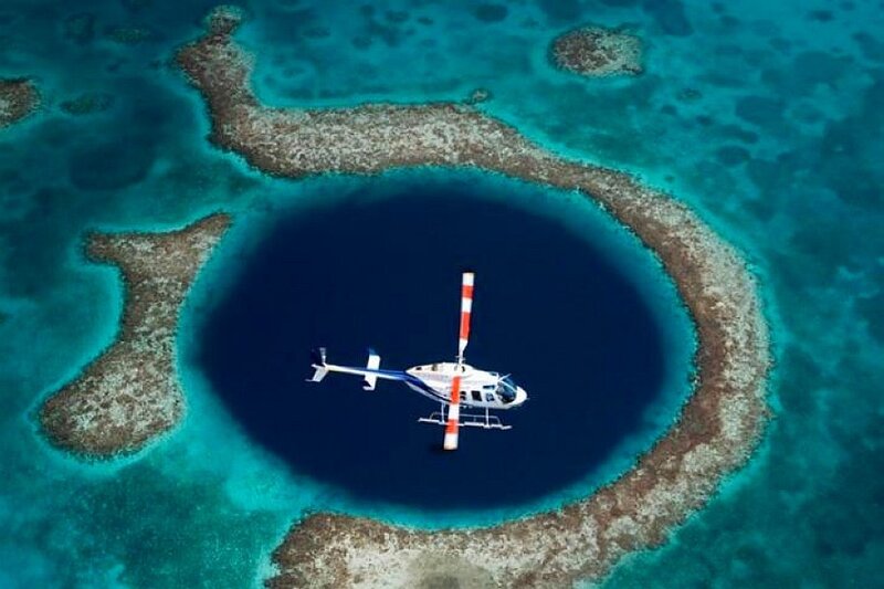 helicopter over blue hole