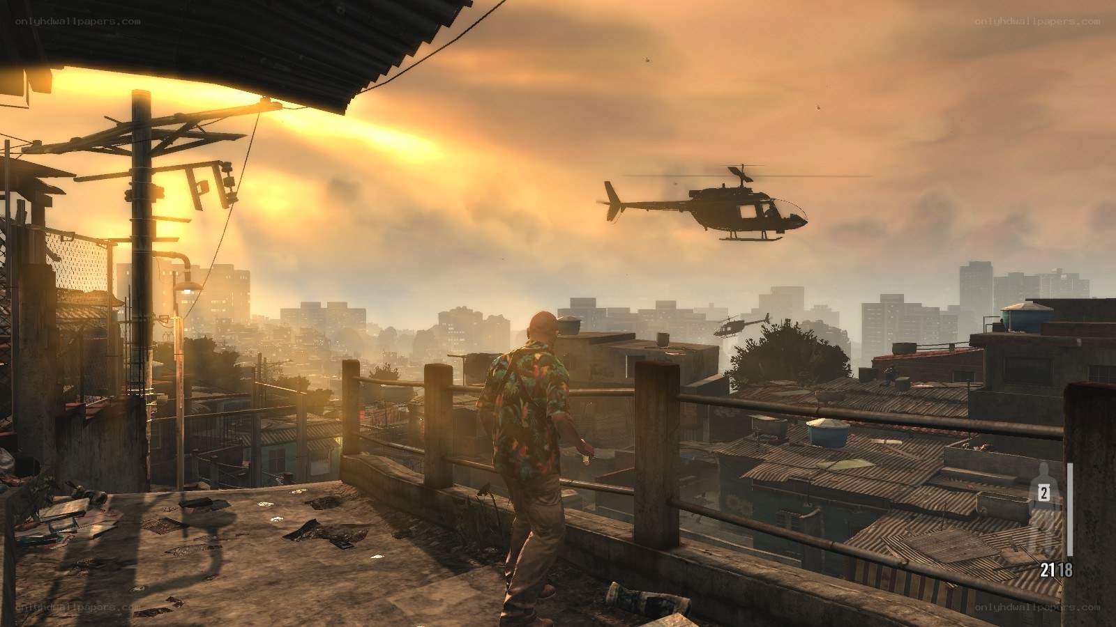 Helicopter over city at sunset
