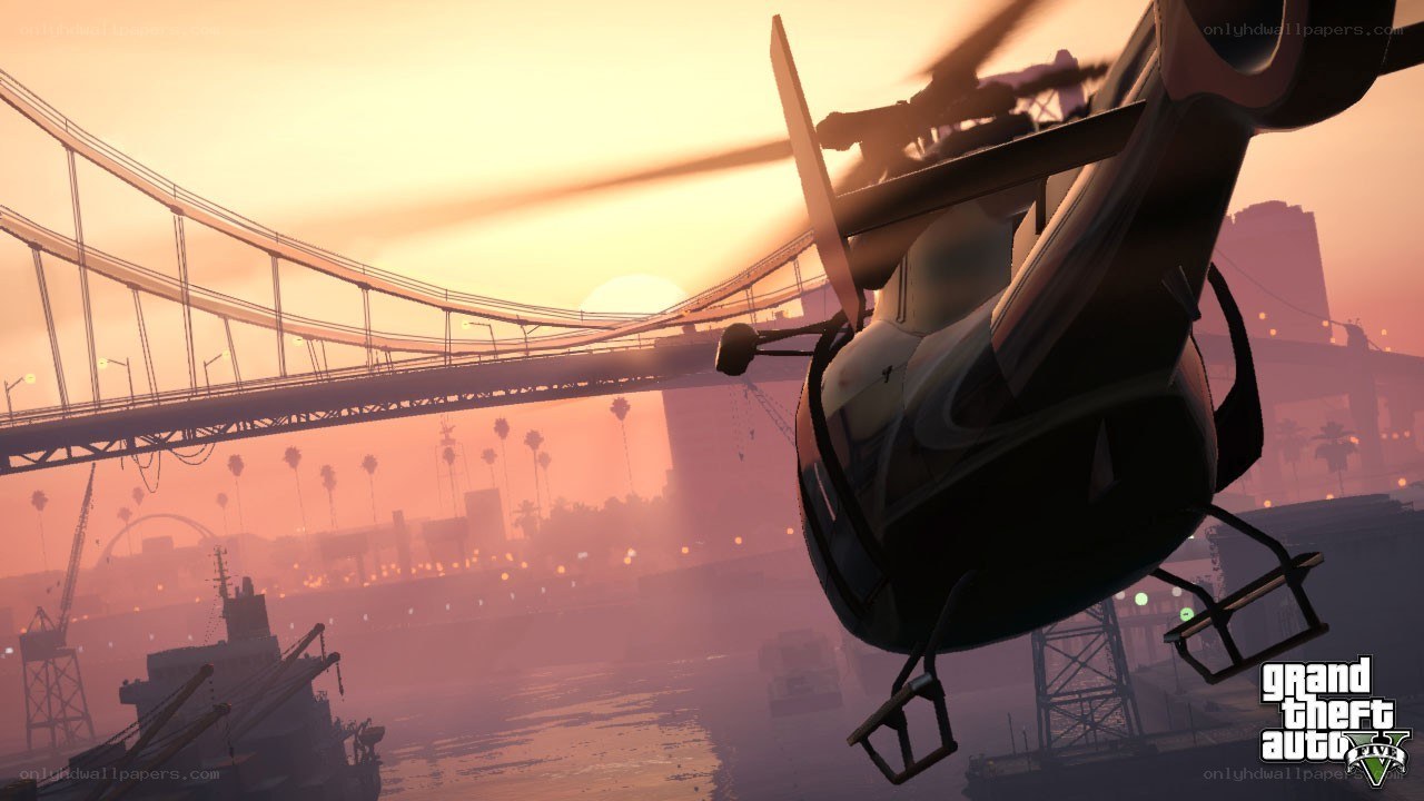 helicopter over city at sunset