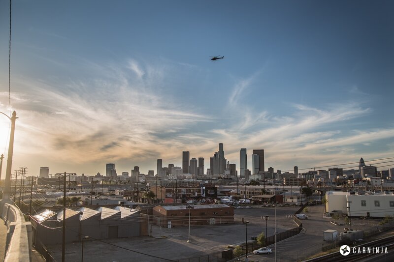 Helicopter over City Skyline — Blue