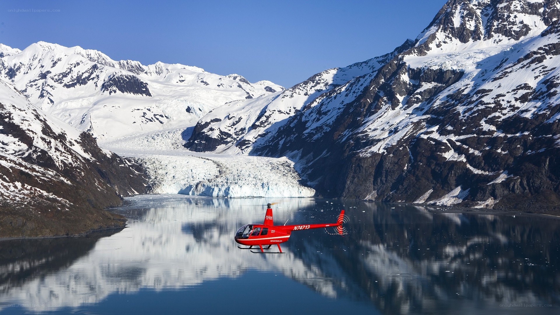 Helicopter over glacier lake