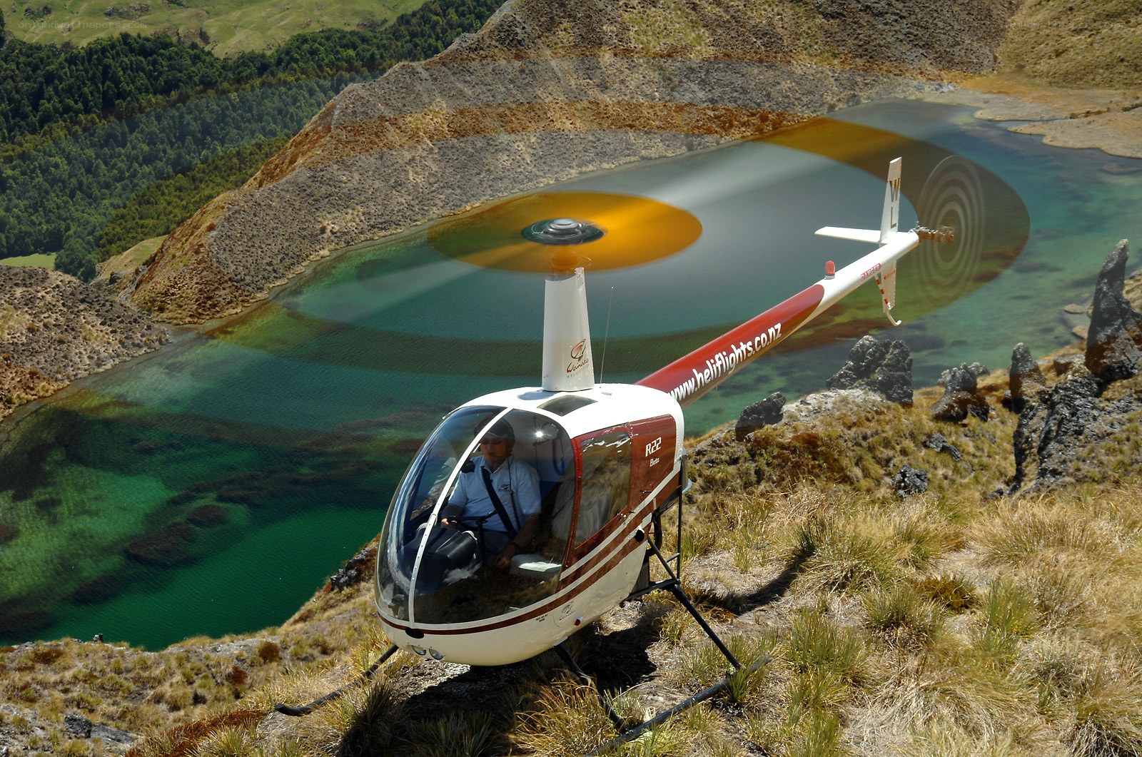 Helicopter over mountain lake