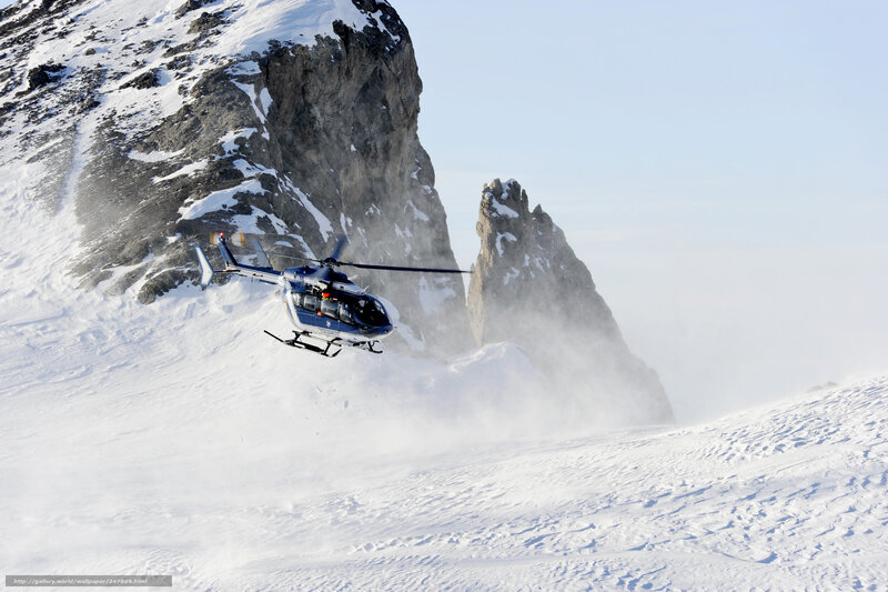 Helicopter over snowy mountain