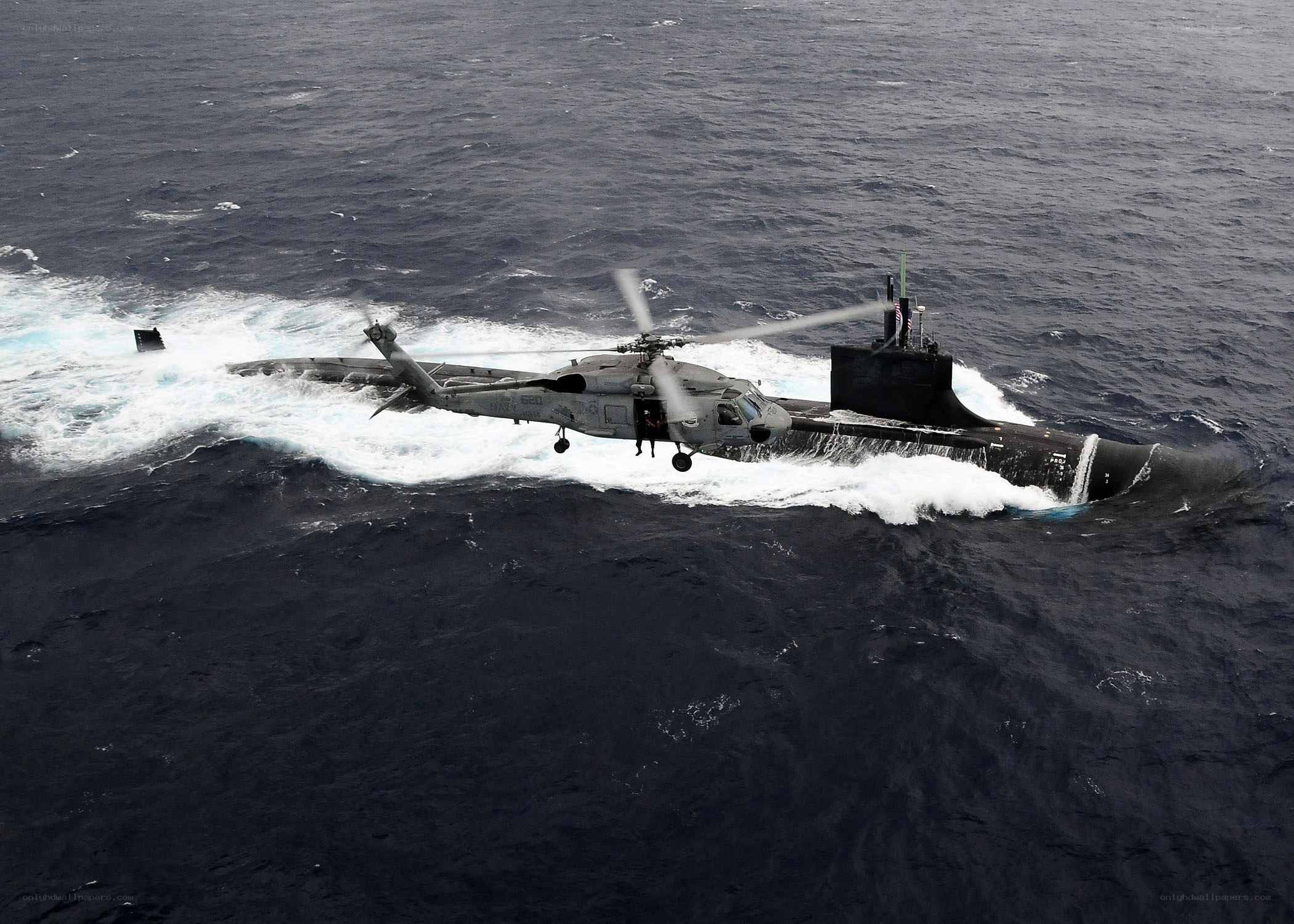 Helicopter over submarine