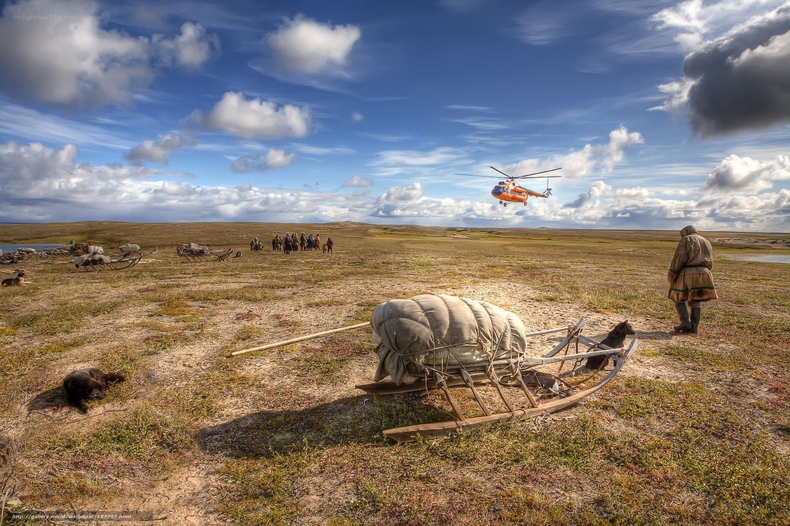Helicopter over tundra settlement
