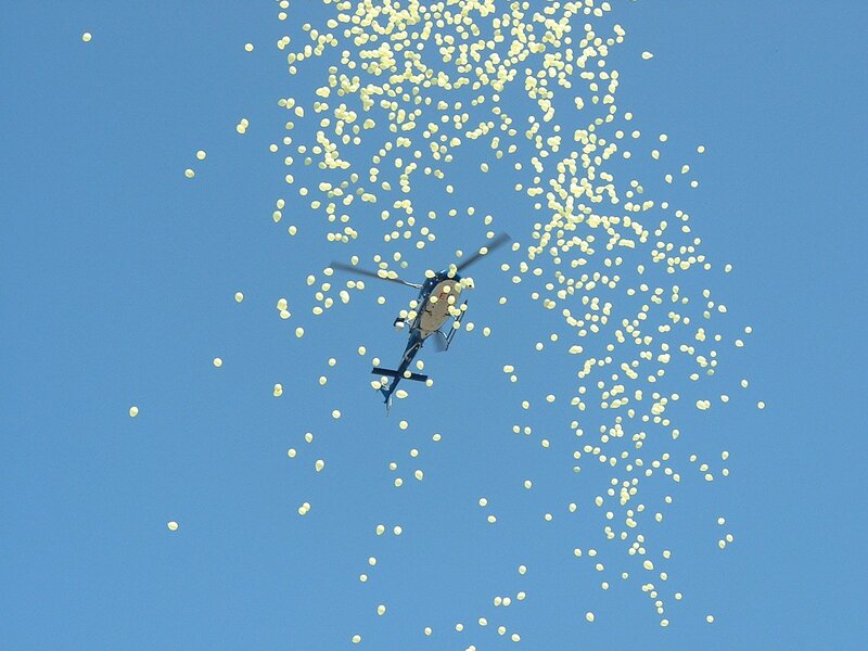 Helicopter releasing balloons