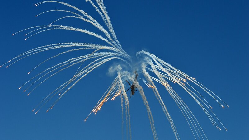 Helicopter Releasing Flares — Blue
