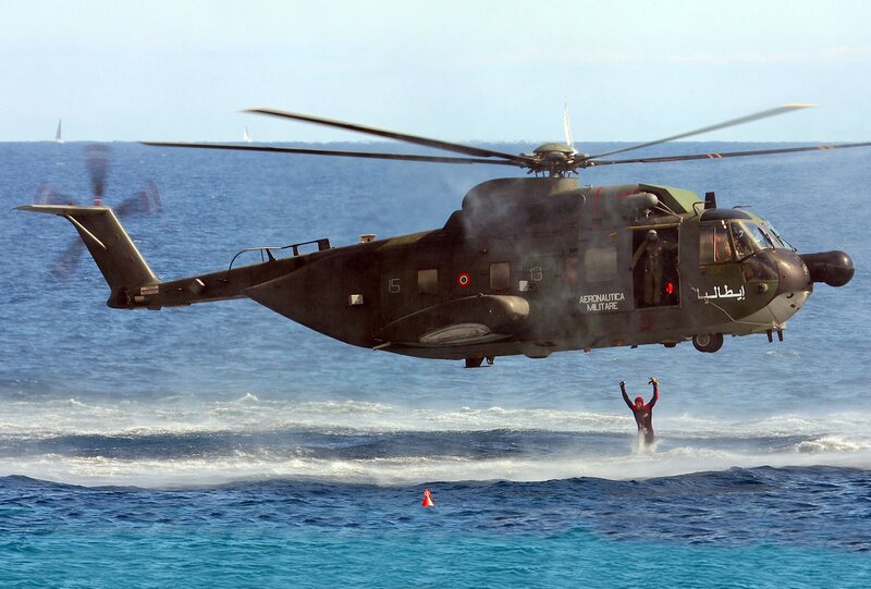 Helicopter rescuing swimmer