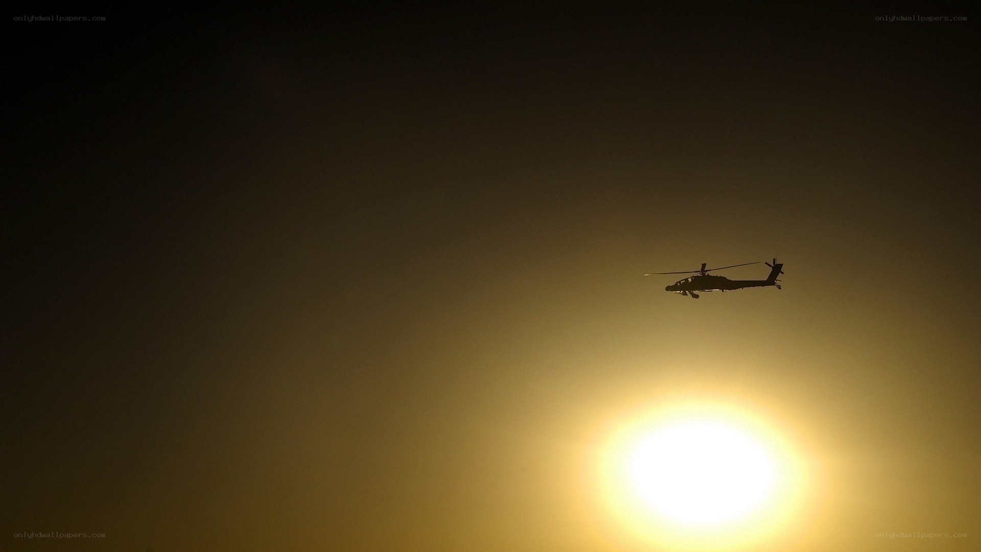 Helicopter silhouette at sunset