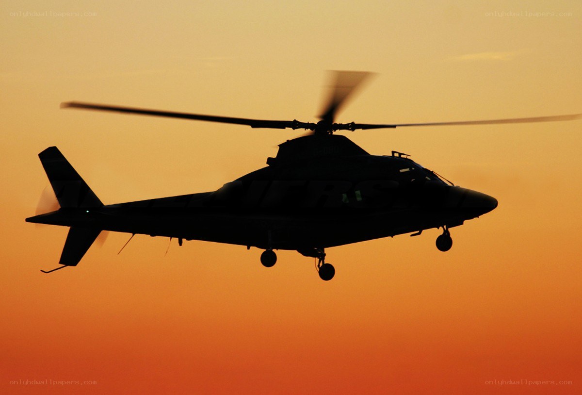 helicopter silhouette at sunset