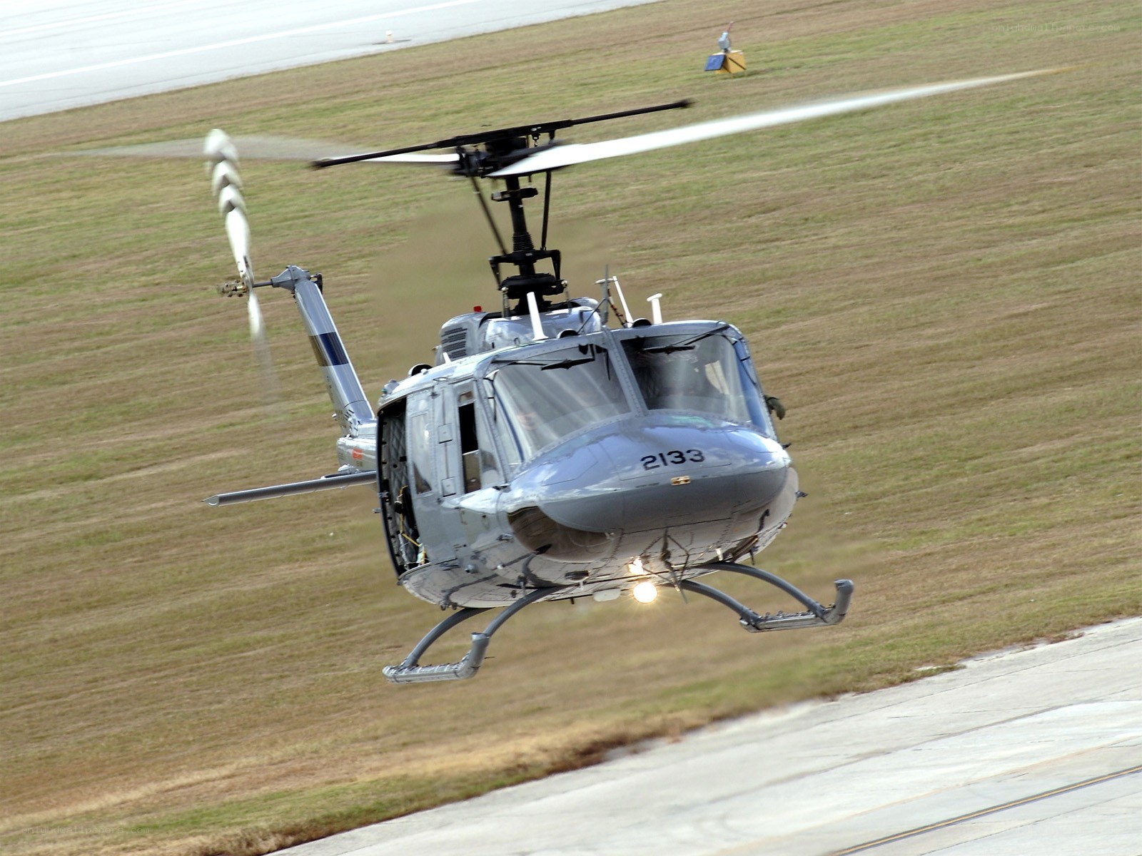 Helicopter taking off from airfield