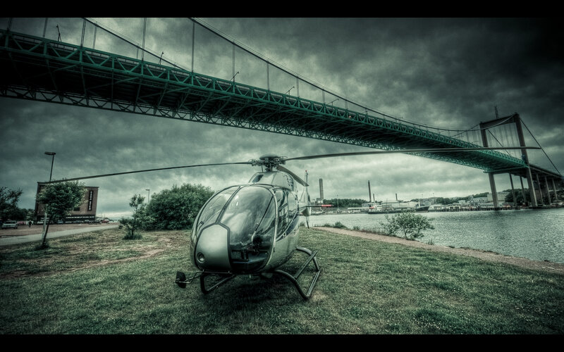Helicopter under a bridge
