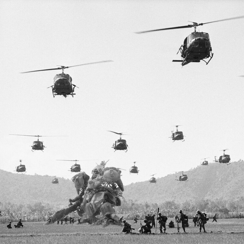 Helicopters and soldiers in field