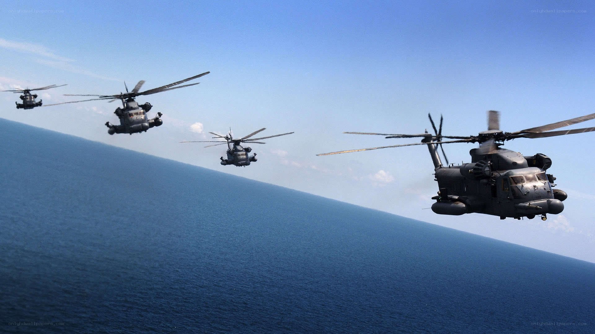 Helicopters flying over ocean