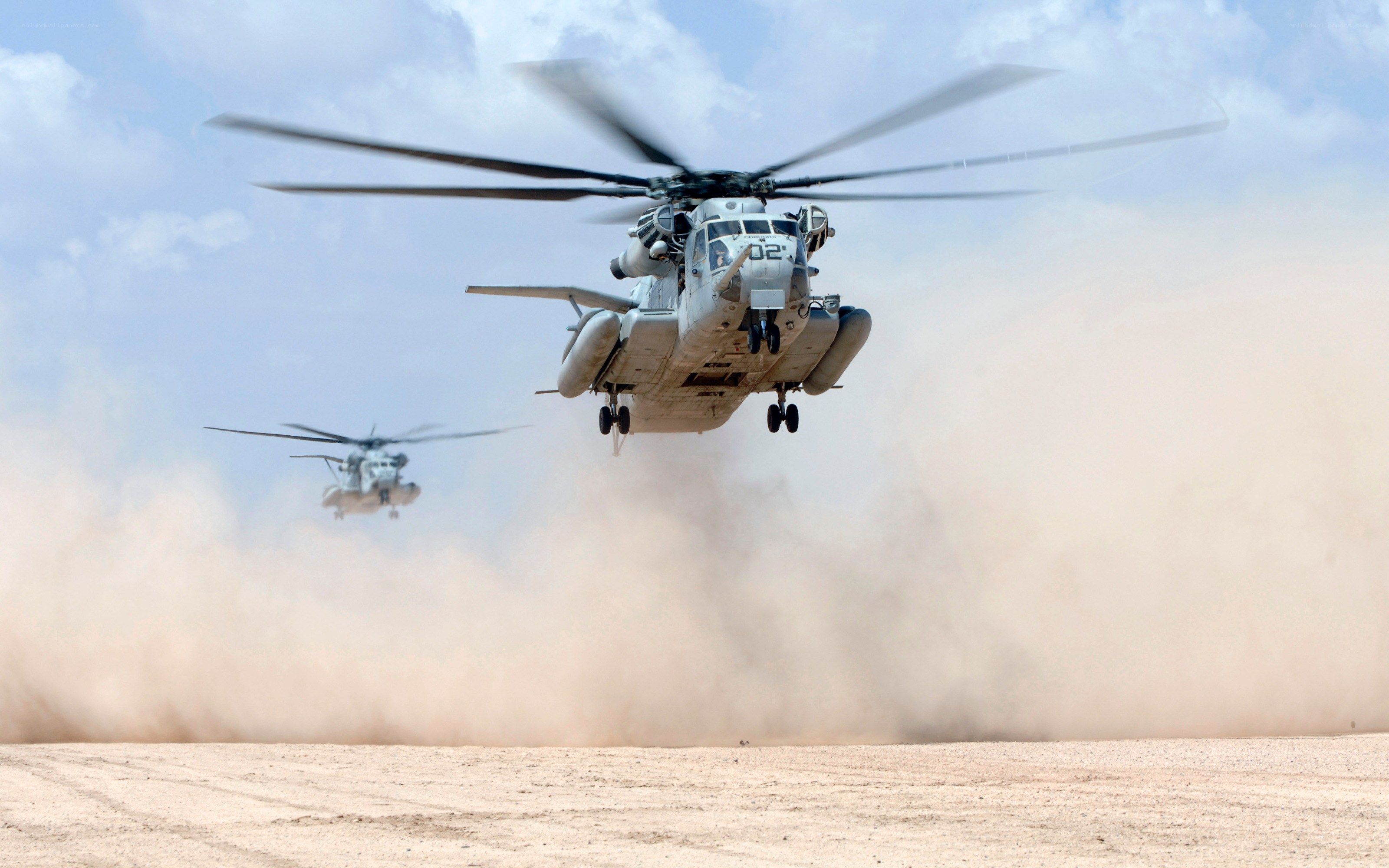 Helicopters in desert dust